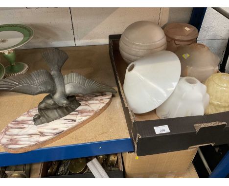 Art Deco glass lamp shades and an Art Deco sculpture of a bird, on marble plinthAppears in good condition. No immediate signe