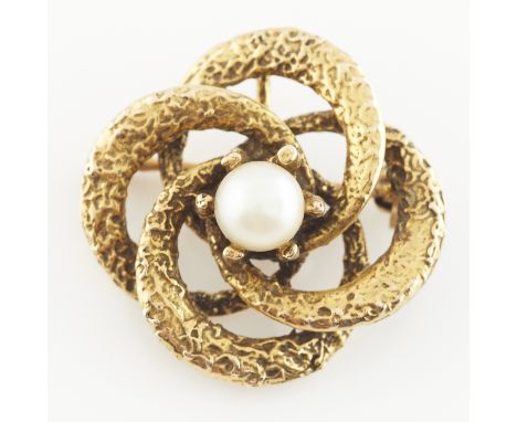 14k textured yellow gold knot brooch comprised of four interlocking circles, set with central pearl in claw setting. With hid