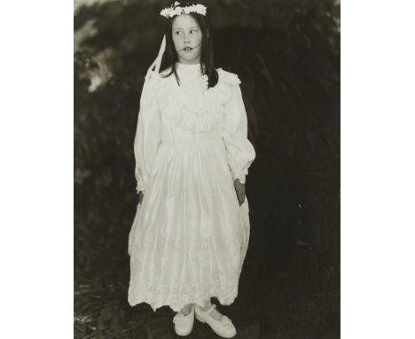 John "Jock" Sturges (American, b. 1947). Gelatin silver print photograph depicting a young girl in a white dress. She wears a