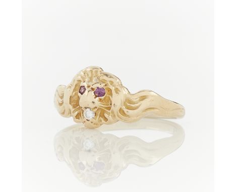 14k yellow gold lion form ring. The main element of the ring a lion's head, with round cut ruby eyes and a brilliant cut diam