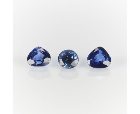 Group of three sapphires. One 0.50 carat round sapphire, two 0.75 carat (each) pear cut sapphires. The pear cuts with wider p
