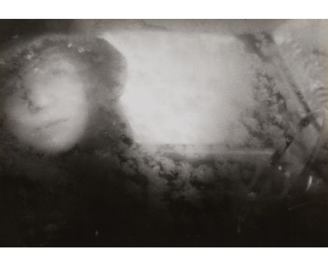 Nick Nixon (American, b. 1947). Gelatin silver print titled "Untitled (Bebe Through Window)" depicting a portrait of a woman 