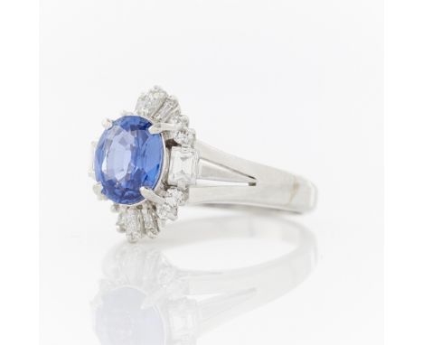 Platinum, diamond and sapphire ring. Center stone is a GIA certified natural, unheated Ceylon sapphire of 1.87 carats. The su