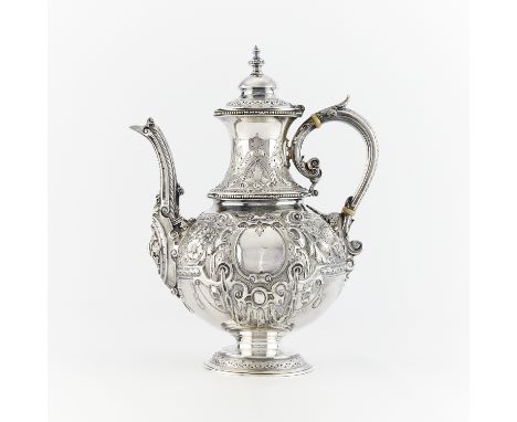 Sheffield, England sterling silver teapot with profuse repousse decoration throughout, 1861. Stamped with the lion passant, c