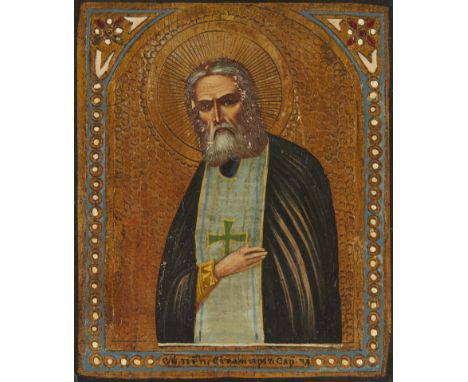 Russian Orthodox oil on board painting of a saint. The bearded figure raises one hand from underneath his cloak. He is portra