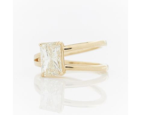 Orianne 18k yellow gold ring with asymmetrical split band. Set with a cut corned rectangular brilliant cut diamond; 2.00 ct, 