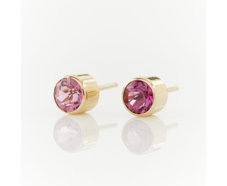 14k yellow gold stud earrings bezel set with round cut pink tourmalines. Unmarked, tested 14k. Pair of earring backs included