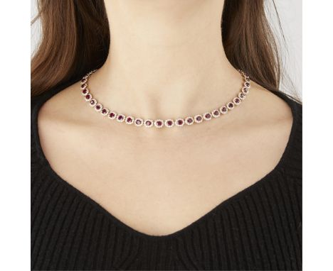 Oscar Friedman 14k yellow gold Burmese ruby and diamond necklace. Set with 50 Burmese rubies (23.18 carat total weight), each