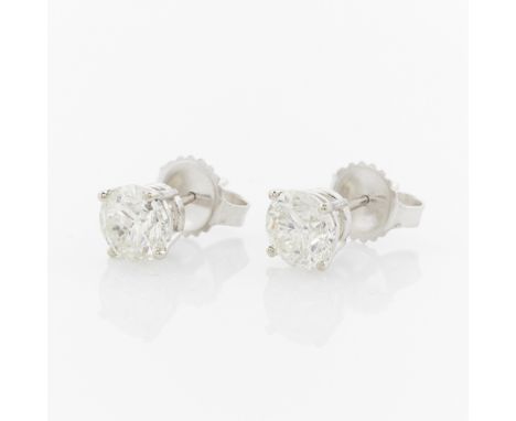 14k white gold diamond studs. Set with two brilliant cut diamonds, G color, I1 clarity, 1.92 carat total weight. With frictio