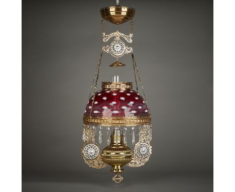 The Rochester Lamp Company, United States. Victorian era hanging parlor lamp. With a hobnail cranberry glass shade and brass 