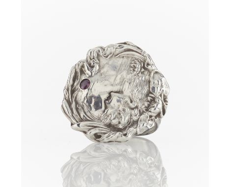 Sterling silver Art Nouveau medallion with a border formed by vegetal motifs and whiplash lines. Within, an Ophelia like figu