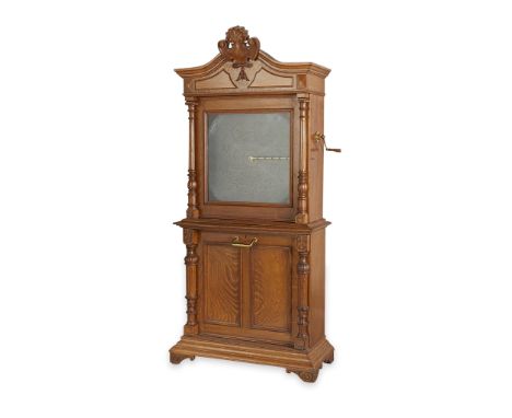 Regina, United States. Two-piece upright music box cabinet with six 27-inch double comb discs, ca. 1890s. With a crank-wind a