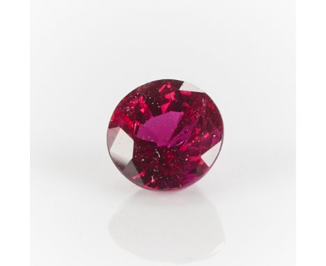 One 0.65 carat round cut ruby.Diameter: 4.79 mm x depth: 3.39 mm. Gross weight: 0.65 ct.Condition:Very minor chip to the pavi