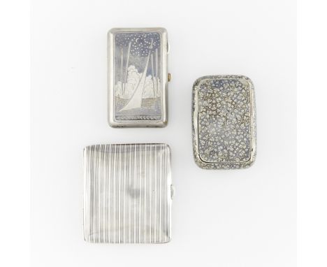 Group of three silver niello cases.One sterling case with niello pin striped exterior and push tab closure. The interior with