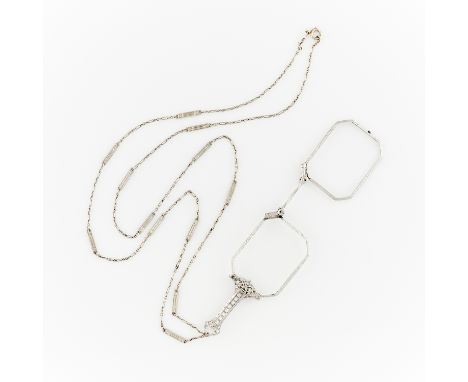 Platinum filigree lorgnettes on a 14k white gold fancy link filigree chain. The lorgnettes are spring loaded, the unfold when