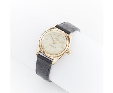 Rolex Oyster Perpetual reference number 4777 Bubbleback in 14k yellow gold. White dial marked Rolex Oyster Perpetual and Offi