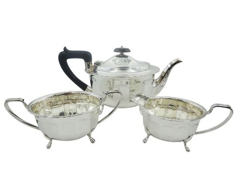 Mid 20th century silver three piece tea service, comprising teapot with ebonised handle and finial, twin handled sucrier, and