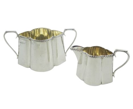 Edwardian silver twin handled sucrier, and cream jug, each of lobed oval form with oblique gadrooned rim, hallmarked Walker &