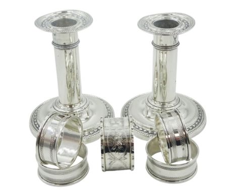 Group of assorted silver, comprising pair of Victorian silver mounted candlesticks with bead and husk detail, hallmarked Jame