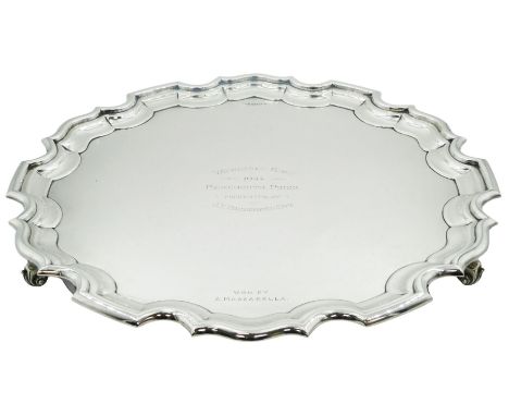 1930's silver salver, of circular form with Chippendale type rim and personal inscription, upon three scroll feet, hallmarked