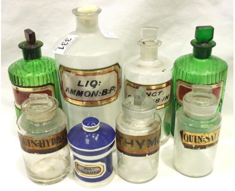 Seven glass and one ceramic pharmacy bottles, largest H: 22 cm. P&amp;P Group 3 (£25+VAT for the first lot and £5+VAT for sub
