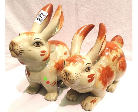 Pair of ceramic rabbits, largest H: 24cm, heavily crazed, repair to one ear, visible glue marks. Not available for in-house P