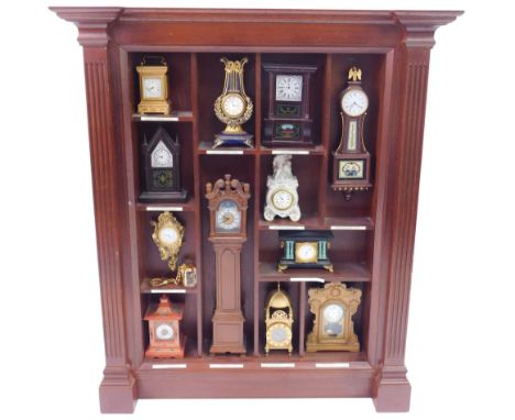 Twelve Franklin Mint miniature clocks from the Treasury of Clocks Collection, comprising Empire carriage clock, Gothic steepl