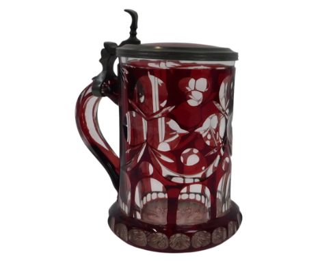 A Continental ruby flash glass stein, with a pewter mounted hinged lid and thumb piece, 15cm high. 