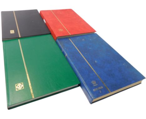 Four stamp albums, containing early 20thC and later GB commemorative and world stamps, to include Indonesia, Portugal, Tanzan