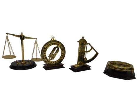 A Franklin Mint universal equinoctial ring dial, 13cm high, a gunner's level, 12cm high, balance scale, 14cm high, and a univ