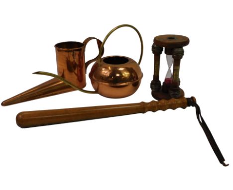 An early 20thC Lignum Vitae truncheon, with a turned wooden handle and leather strap, 42cm high, together with a copper and b