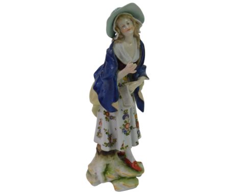 A 19thC Ludwigsburg porcelain figure, modelled as a lady wearing a green hat and blue half-length cloak, on a naturalistic ba