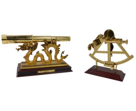 A Franklin Mint National Maritime Historical Society spy glass, 19cm high, and a Discovery of America commemorative sextant, 
