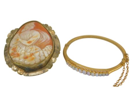 A Victorian cameo brooch, depicting a maiden in classical dress playing a baby harp, in a gilt metal surround, 7.5cm high, (A
