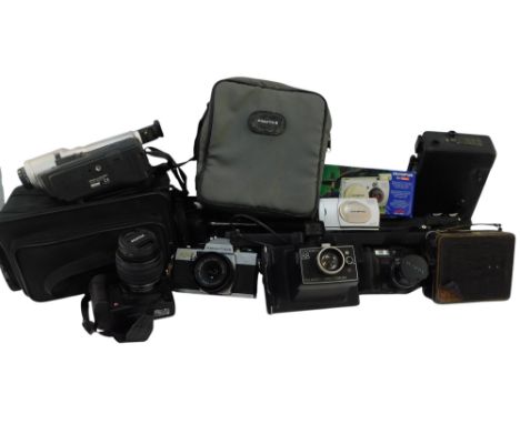 A group of cameras and optical related equipment, to include a Kodak Model B cine camera, a Coronet cine camera, in a brown l