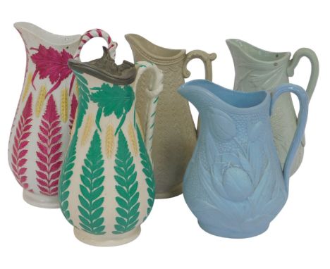 A group of 19thC Dudson Brothers relief moulded jugs, in various sizes and styles, one with a hinged lid, including harvest j
