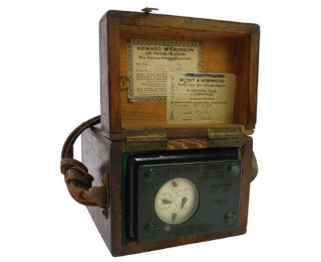 A Sky Master Ghost High Speed pigeon clock, in an oak case, with a brown leather carrying handle, 19cm high. 