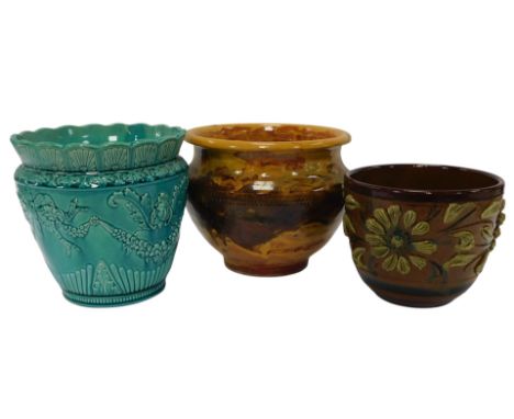Three pottery jardinieres, comprising a Burmantofts style glazed turquoise relief moulded jardiniere, decorated with bows and