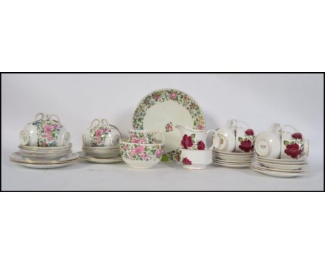 A vintage Crown Staffordshire china part tea service in a chintz pattern  having 6 place setting. Together with another