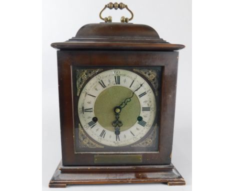 A mahogany cased mantel clock, with a Westminster striking brass movement, inscription plaque stating presenting to A.Tompkin