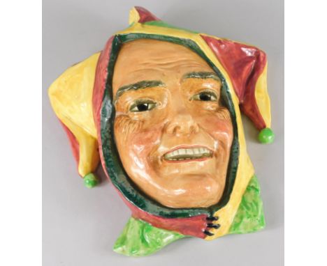 A Royal Doulton ceramic wall mask, modelled in the form of a jester, printed mark in black to underside and indistinct number