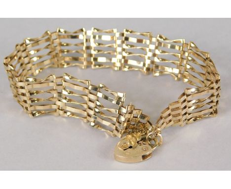 A 9ct gold gate bracelet, with six row design, and padlock, 6.7g all in. 