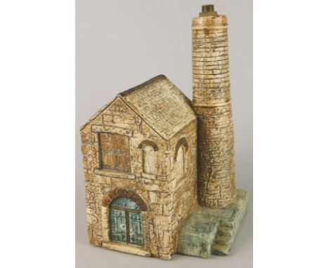 A Troika tin mine engine house lamp base, with a brown glaze, decorator's monogram, 23cm high