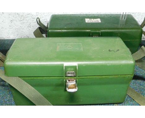 Two army field telephones, each in plastic cases