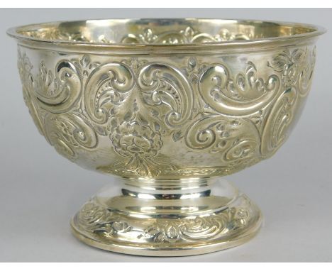 A George V silver sugar bowl, embossed with scrolls, leaves etc., and with two vacant cartouches, Sheffield 1911, 6oz 