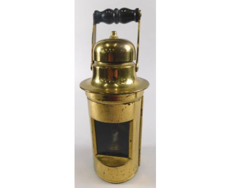 A late 19th/early 20thC brassed metal doctor's lamp, the swivel top with turned ebonised handle, a ceramic wick holder etc., 