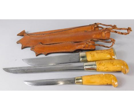 Three Scandinavian hunting knives, one with engraved blade named J Ives, another with an embossed leather scabbard and engrav