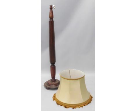 A part turned mahogany standard lamp, on a tapering base