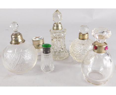 Various cut glass perfume bottles, to include a bulbous example with silver collar, cut glass stopper, 12cm high, another wit