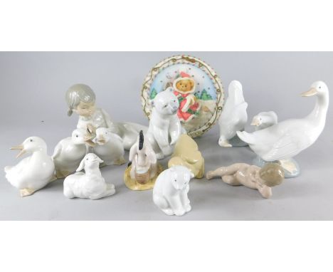 Various Lladro, Nao and other figures, to include recumbent girl, 22cm wide, Christmas Place, Royal Doulton Eeyore's Birthday